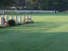 Long shadows in the morning sun formed by rows of gravestones